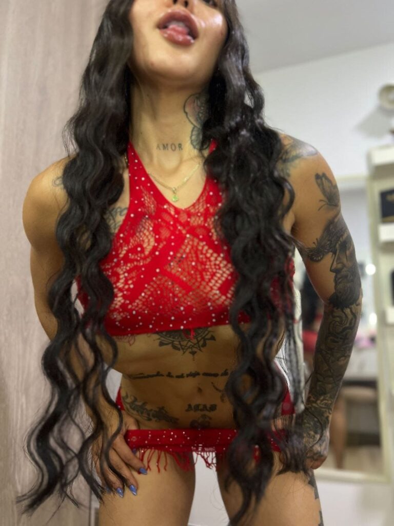 Pamela, a 24-year-old escort, shows off red lingerie in Malaga